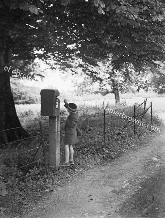 GIRL AT LETTERBOX